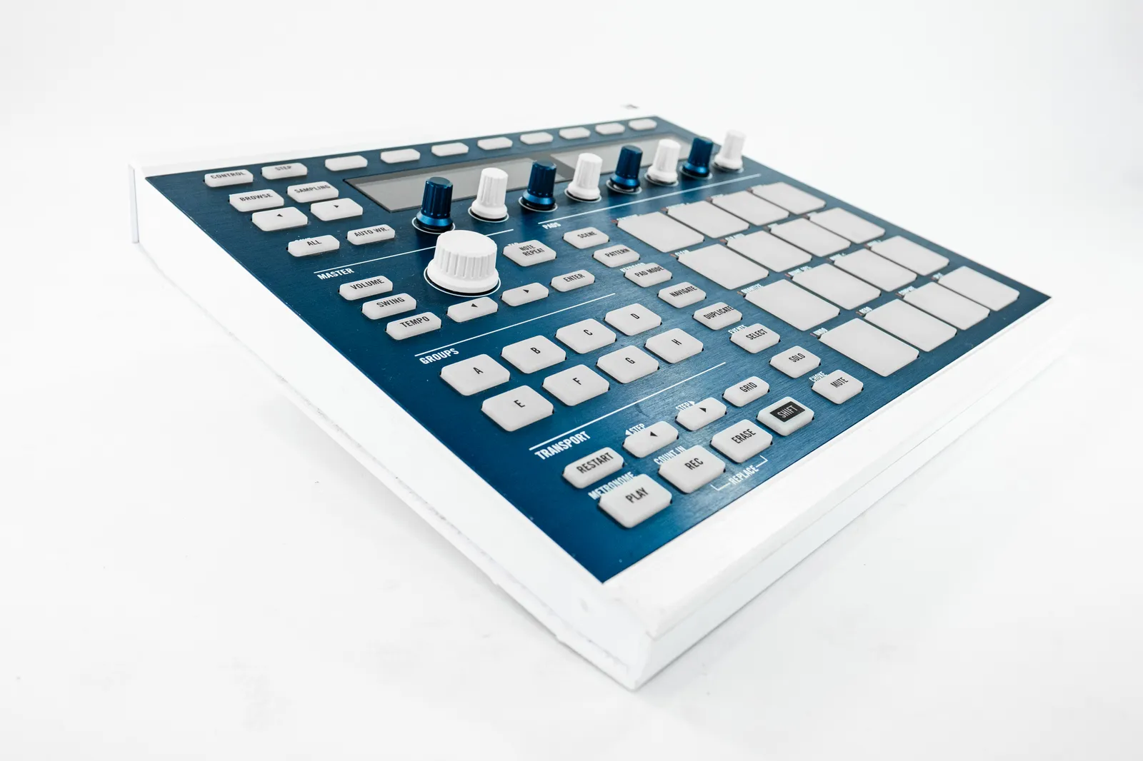 Music production controller setup showing keyboard controller and pad controller on a studio desk