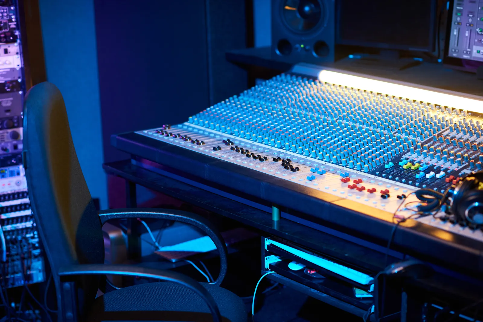 Mixing console faders and compressor controls for parallel compression in a studio